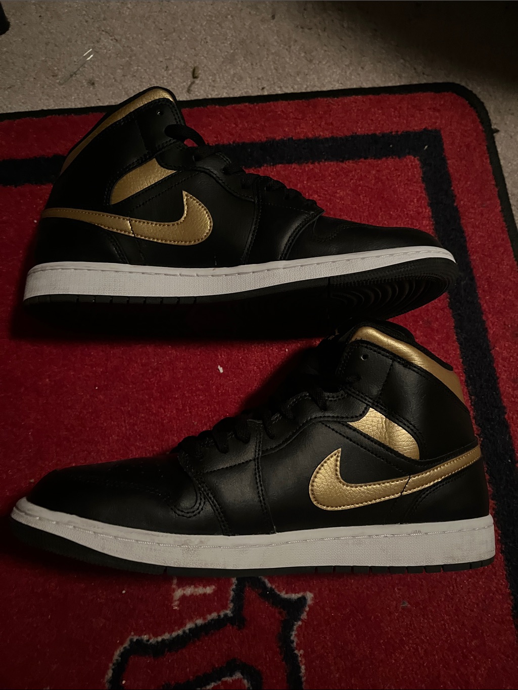 Nike Men’s Air Jordan 1 Black And Gold Mid-Top Sneakers